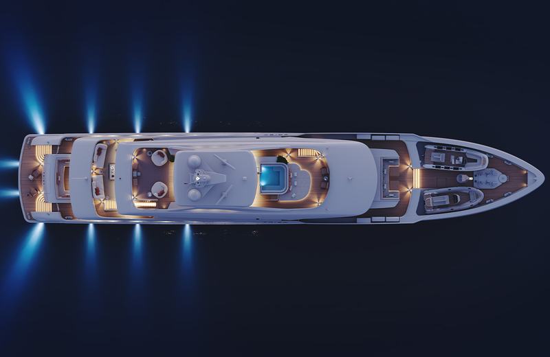 Project Frida - Aerial view of a well-lit yacht at night on dark waters, featuring multiple deck