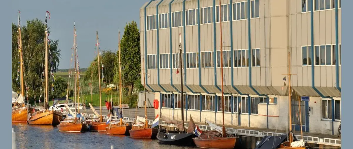 Historical Huisman Boat Owners Continue Preservation of Early Wooden Fleet — official source image