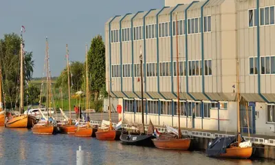 Historical Huisman Boat Owners Continue Preservation of Early Wooden Fleet — official source image