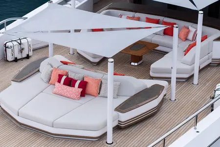 Sparta - A luxurious yacht deck featuring modern, white cushioned seating areas with colo