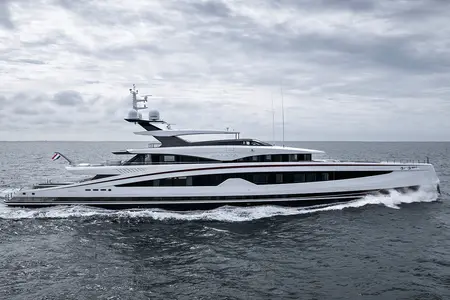 Sparta - A luxury yacht named Sparta cruising on the ocean under a cloudy sky, with waves
