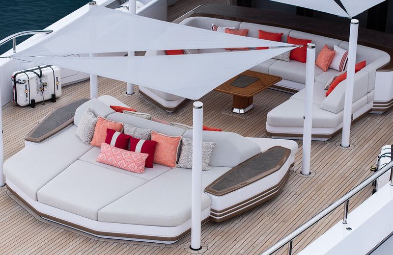 Sparta - A luxurious yacht deck featuring modern, white cushioned seating areas with colo