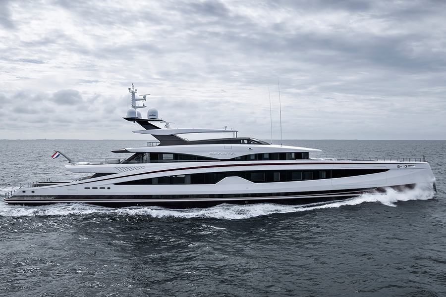 Sparta - A luxury yacht named Sparta cruising on the ocean under a cloudy sky, with waves