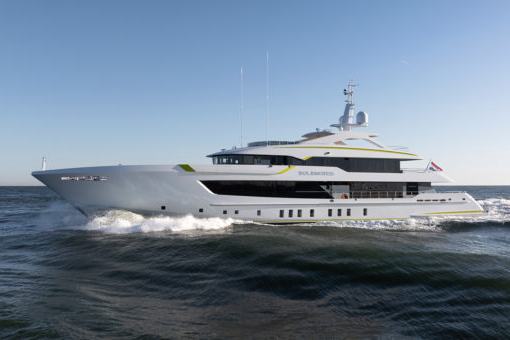 Agnetha - A luxury yacht cruising on open water under a clear blue sky, with waves forming