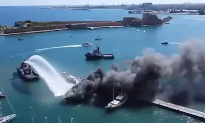 30m Sanlorenzo JOHN Partly Submerged After Brindisi Marina Fire — source image