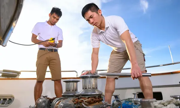 Superyacht crew at work — Source: Crew Asia