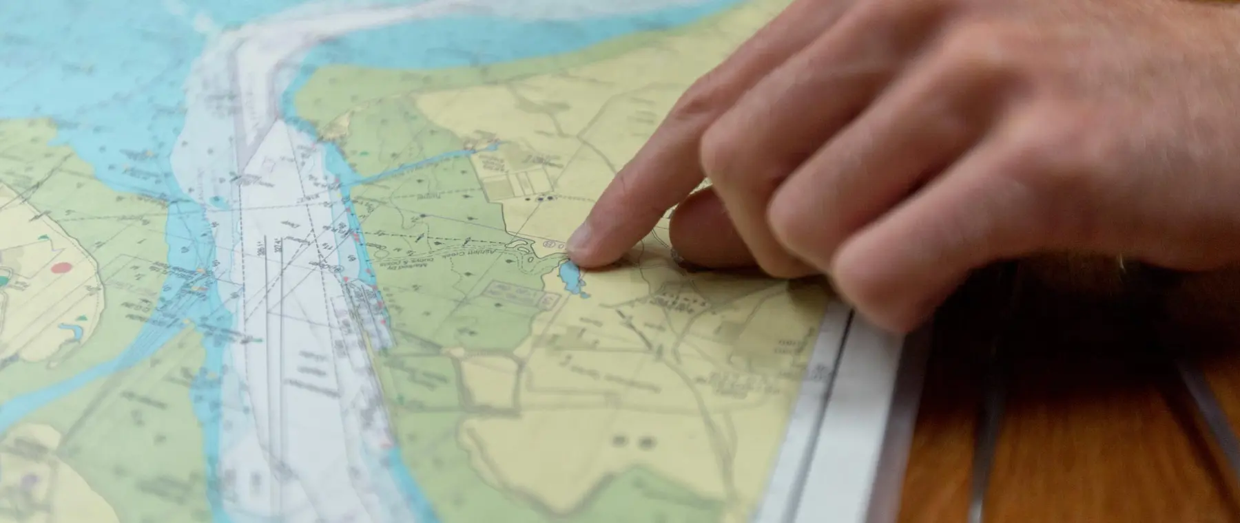 RYA paper-chart consultation — official Royal Yachting Association photograph