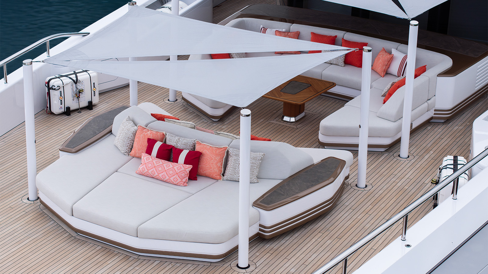 Sparta - A luxurious yacht deck featuring modern, white cushioned seating areas with colo